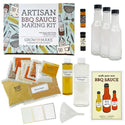 The contents (3 bottles, 2 vinegars, multiple seasoning packets, instructions, a funnel and labels) shown next to the box