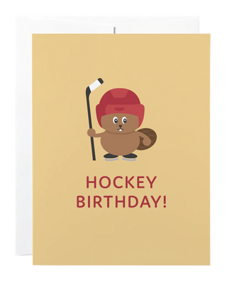 A brown card with a beaver in a hockey helmet and skates holding a hockey stick and the words 