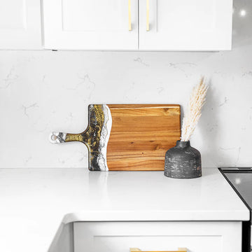 Lynn & Liana Large Cheeseboard (10 x 20") - Handmade Canadian Lynn & Liana large cheeseboard with natural wood and artistic black, white, and gold resin detail, unique.