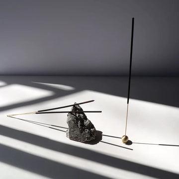 Incense Sticks - Evergreen - Handmade Canadian incense sticks in black, displayed with a unique stone and wooden holder, ideal gift.