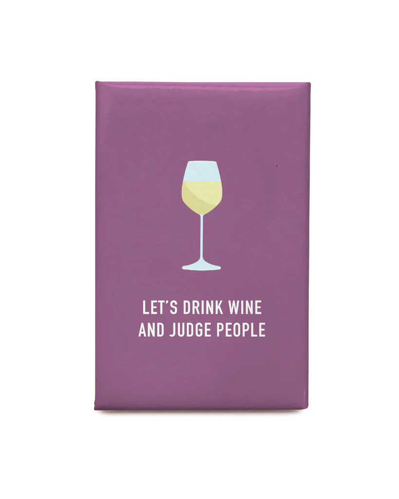 A purple magnet with a picture of a wine glass and the words "Let's Drink Wine and Judge People"