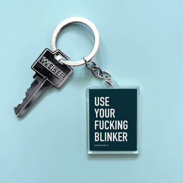 Use Blinker Keychain - Handmade Canadian keychain with bold white text "Use Your Fucking Blinker" on black, unique gift accessory.