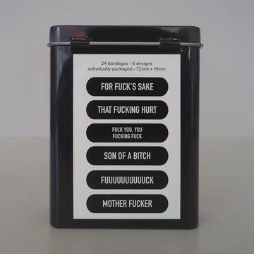 Man-Daids Bandages - Black metal tin with uniquely printed Man-Daids bandages featuring bold, cheeky phrases, handmade Canadian gift.