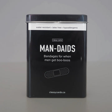 Man-Daids Bandages - Black rectangular tin with Man-Daids bandages, marked unique handmade Canadian gift, water-resistant and hypoallergenic.
