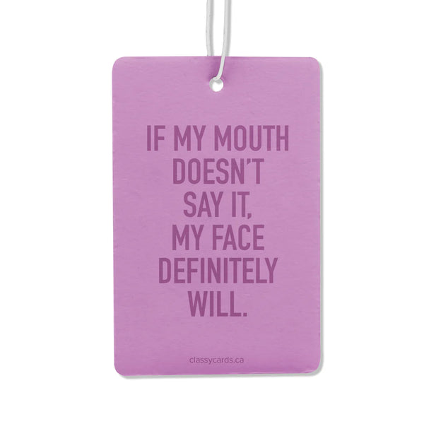 A purple air freshener with the words 