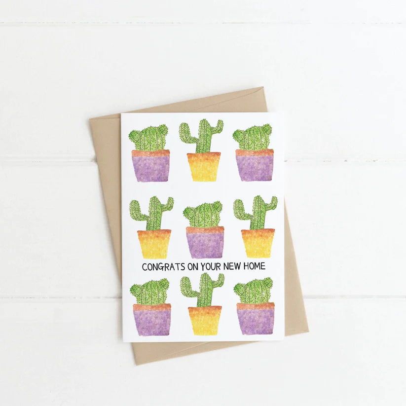 A white card with a variety of cacti and the words "Congrats on Your New Home"