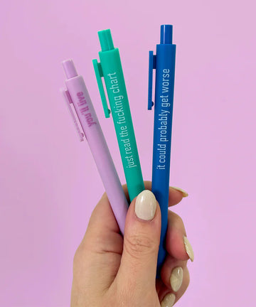 Overworked Nurse Pens - Set of three unique handmade Canadian nurse pens in pastel pink, teal, and blue with cheeky phrases on a lavender background.