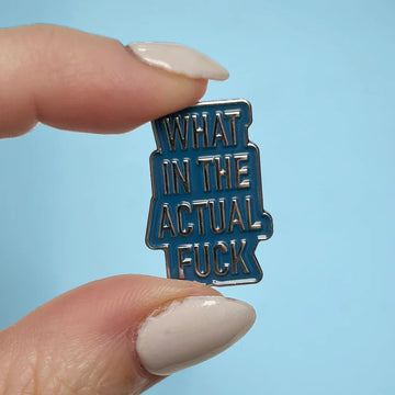 What in the Actual Fuck Enamel Pin - Blue enamel pin with bold silver lettering reading "What in the Actual Fuck," handmade Canadian gift accessory.
