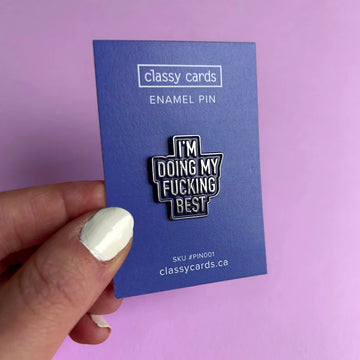 Fucking Best Enamel Pin - Black enamel pin with white bold text reading "I'M DOING MY FUCKING BEST" on purple backing card.