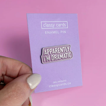 Apparently I'm Dramatic Pin - Handmade Canadian enamel pin with "Apparently I'm Dramatic" text on purple backing, unique gift accessory.