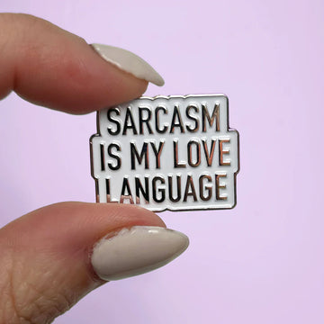 Sarcasm Love Language Enamel Pin - Handmade Canadian enamel pin with bold black text reading Sarcasm Is My Love Language, unique gift accessory.