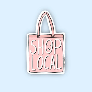 A sticker of a pink tote bag that says 