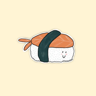 A sticker shaped like a shrimp nigiri with a smiley face