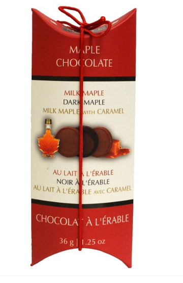 Assorted Maple Chocolates - Tall Pillow Box - Tall pillow box of assorted handmade Canadian maple chocolates with red and cream packaging and tied with red string gift bow.