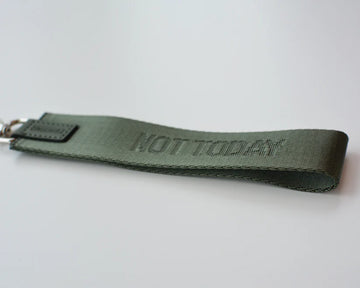 Not Today Wristlet - Olive green handmade leather wristlet embossed with "Not Today," unique Canadian accessory gift.