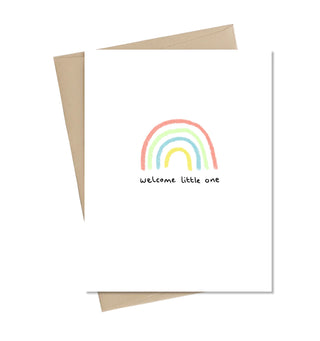A white card with a rainbow in the middle and black text reading 