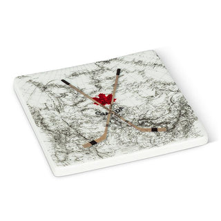 White, square coaster with a black navigational map of Canada. On top, there are two wooden hockey sticks crossed over each other and a red maple leaf.