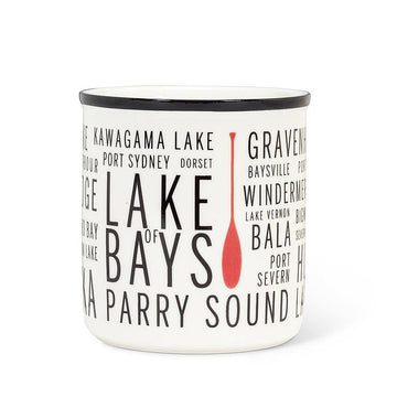 Muskoka Mug - White enamel mug with black rim featuring Canadian lake and bay names in bold black text and a red paddle graphic, unique.
