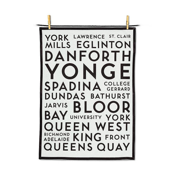 White tea towel with a black border and black text listing streets names from Toronto.
