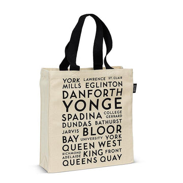 Toronto Names Tote Bag - Canvas tote bag with black handles featuring bold Toronto street names print, unique handmade Canadian gift.