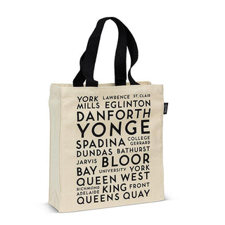White canvas tote with black handle and text listing Toronto street names.