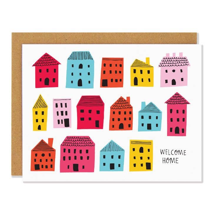 A white card with different colored houses and the words "Welcome Home"