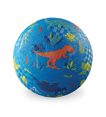 A blue ball with different dinosaurs and plants printed on it