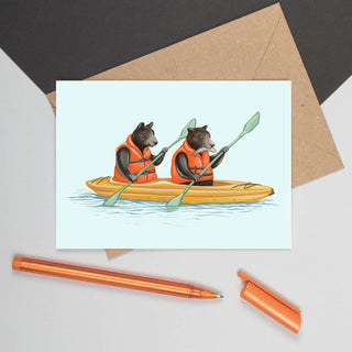 A white card with black bears wearing life jackets kayaking