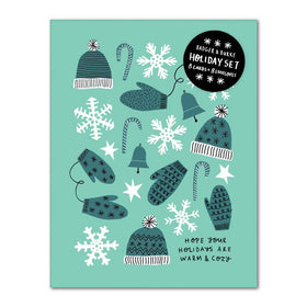 A blue card with mitten and glove patterns with the words "Hope Your Holidays Are Warm and Cozy"