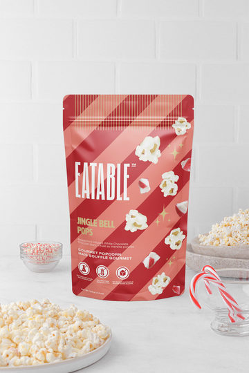 Jingle Bell Pops - Chocolate Kettle Corn (Eatable) - Red and white striped pouch of handmade Canadian Jingle Bell Pops chocolate kettle corn gift with festive popcorn and candy.
