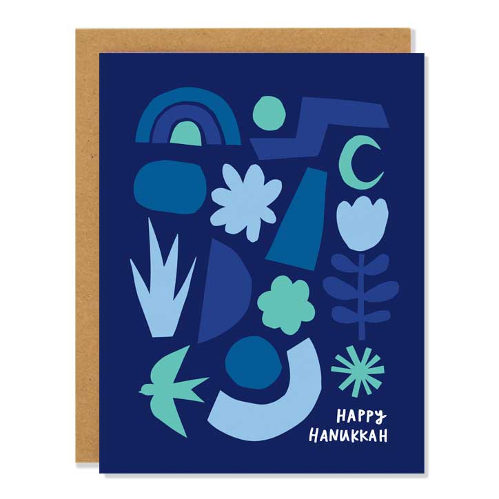 A blue card with abstract shapes on it with the words "Happy Hanukkah" on the bottom right 