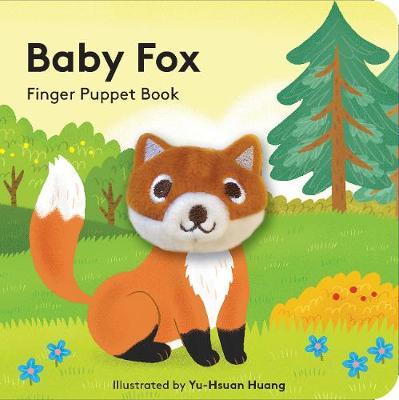 A book with a fox sitting in a forest. The head of the fox is a finger puppet
