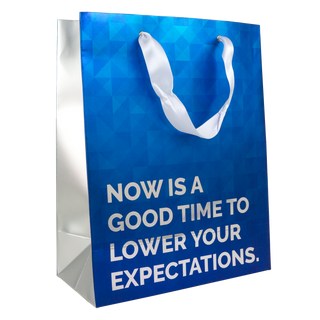 A blue and foil colored gift bag with the words 