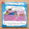 A blue magnet with a person laying on the couch with their dog listening to the radio and the words “Why I love CBC Radio… CBC Radio is the soundtrack to my childhood. It feels like home”