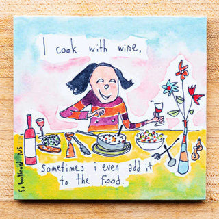 A magnet with a cartoon girl cooking and the words 