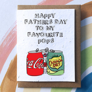 A white card with pop cans and the words 