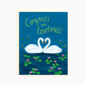 A blue card with 2 swans forming a heart and the words "Congrats you lovebirds"