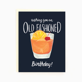 A black card with an old fashioned alcoholic drink and the words "Wishing You An Old Fashioned Birthday"