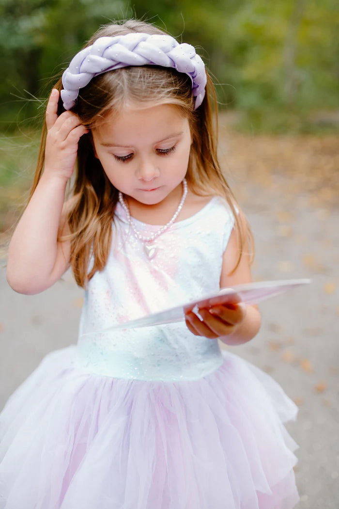 A girl wearing the Plush Braid Headband