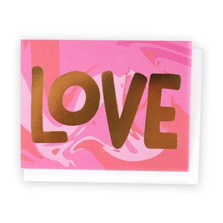 A pink marble card with the word 