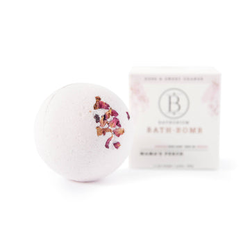 Mama’s Perch Bath Bomb - Round pale pink bath bomb with dried flower petals, handmade Canadian gift with white branded box.