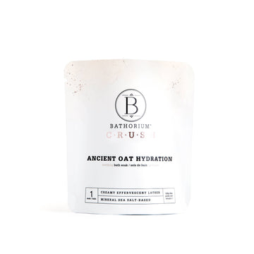 Ancient Oat Hydration Crush Bath Soak - Minimalist white pouch of handmade Canadian Ancient Oat Hydration Crush Bath Soak, unique spa gift.