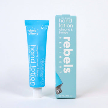 Hand lotion - ALMOND HONEY - Blue tube of handmade Canadian almond honey hand lotion next to matching rectangular box gift packaging.