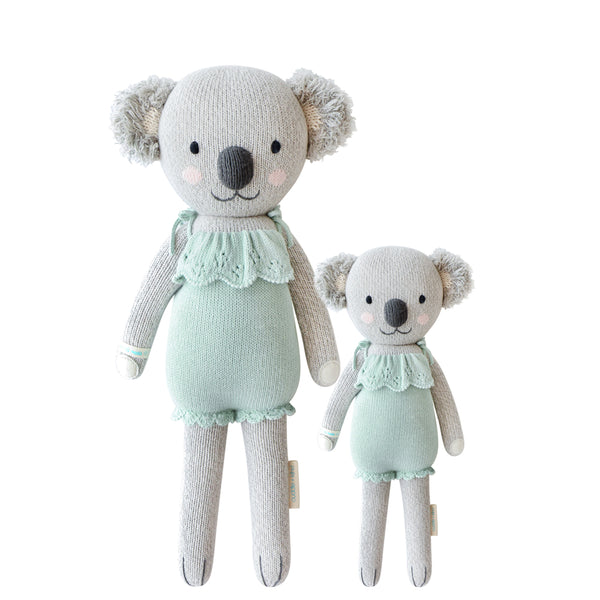 2 different sized koala stuffies both wearing a teal dress 