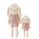 2 different sized bunny stuffies wearing pink dresses