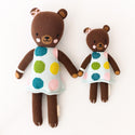  2 different sized brown bear stuffies wearing a polka dot dress