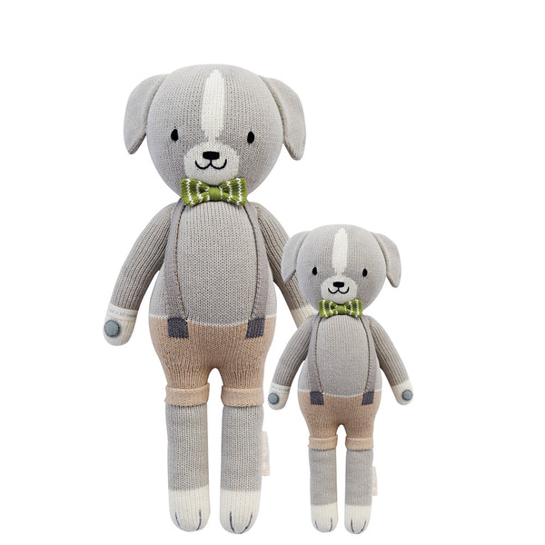 2 different sized dog stuffies wearing beige overalls