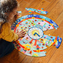 A child building the round clock puzzle