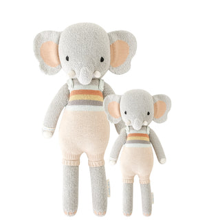 2 different sized elephant stuffies standing beside each other