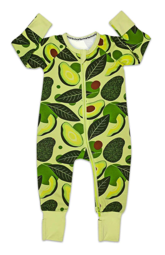 A green jumper with avocado slices, unpitted and pitted avocados and leaves printed on it